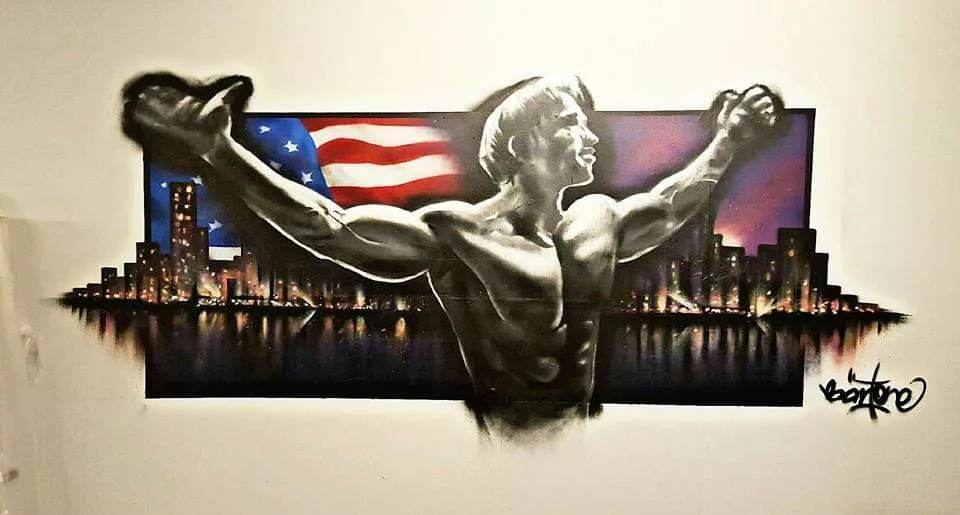 Wandbild mit Boxer, amerikanischer Flagge und Stadtsilhouette